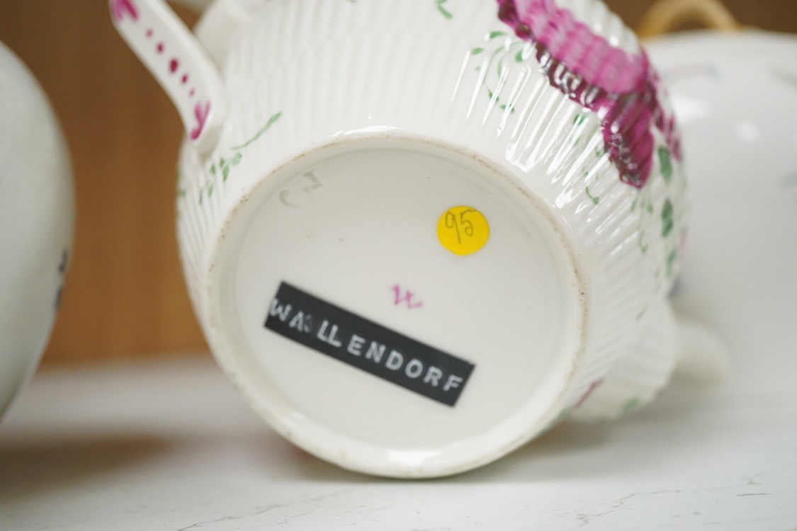 An 18th Furstenburg porcelain teapot and cover, a Wallendorf porcelain teapot and cover and a Meissen style teapot, 12cm high